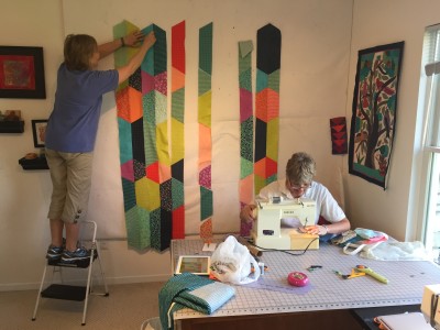 Friends and relatives gathered this week to prep samples for spring Quilt Market. Beth's mom is on the step stool. Her aunts also helped out.