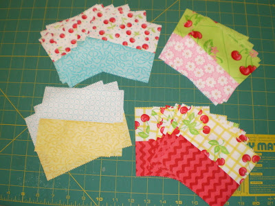 Parts of blocks are ready to stitch together to make Sherri's jelly roll placemats (tutorial on her blog)