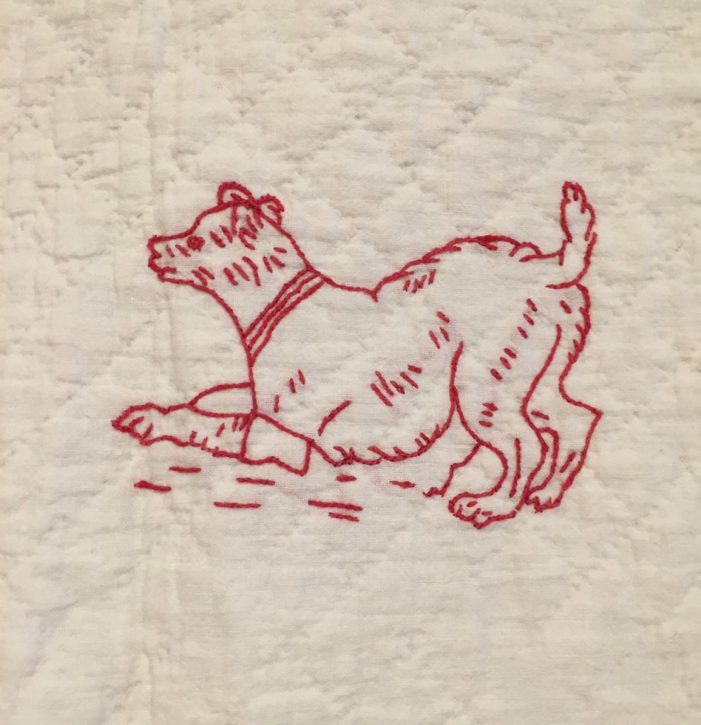 Detail from a c. 1920 redwork quilt.
